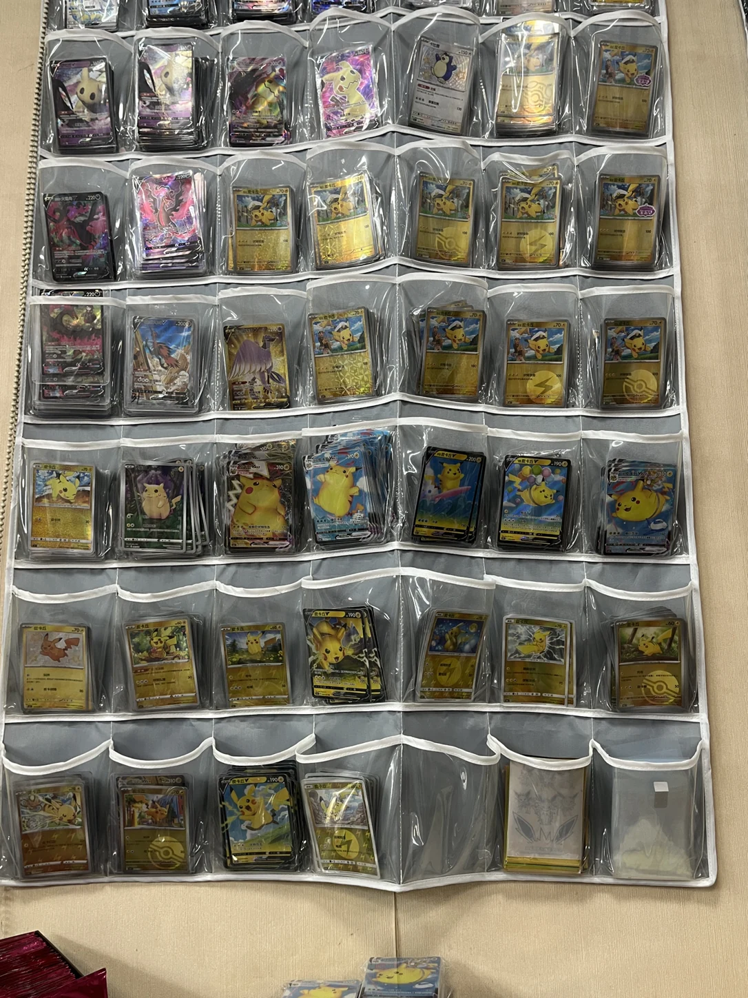 Original reference photograph showing several Pikachu card designs